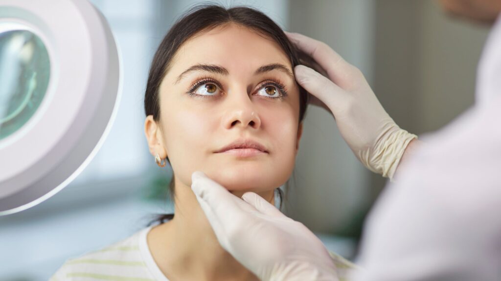Dr Laith Barnouti checking face for surgery
